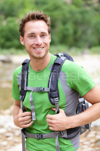 Active man portrait of sporty guy hiking outdoors Stock photo © Maridav