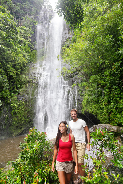 Hawaii tourists hiking by waterfall Stock photo © Maridav