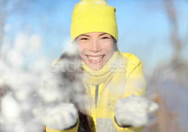 Winter snow fight girl playing throwing snowball Stock photo © Maridav