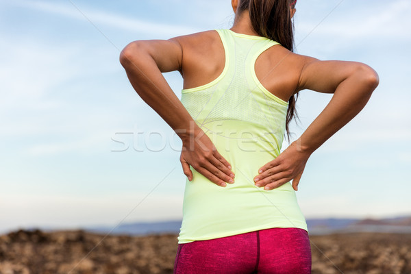 Trail running runner with lower back pain Stock photo © Maridav