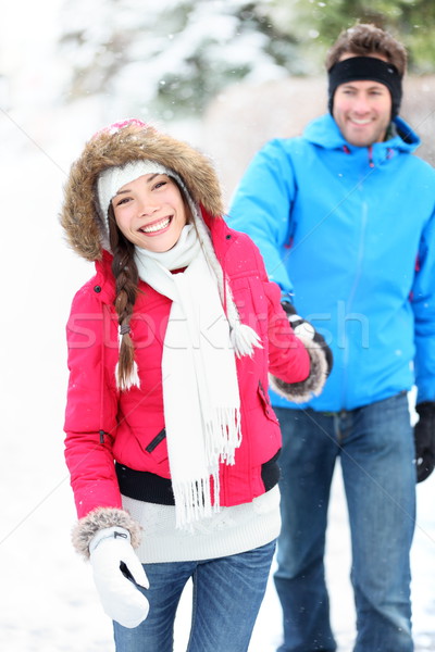 Happy winter couple in snow Stock photo © Maridav
