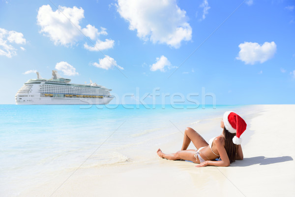 Christmas cruise travel - woman tanning on beach Stock photo © Maridav
