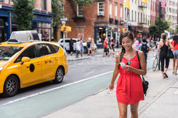 Woman walking in new york city using phone app Stock photo © Maridav