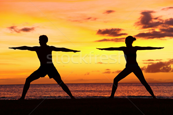 Yoga people training and meditating warrior pose Stock photo © Maridav