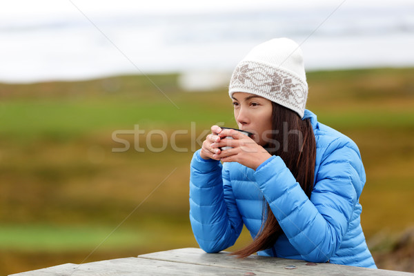 Woman in outdoors drinking coffee from cup Stock photo © Maridav