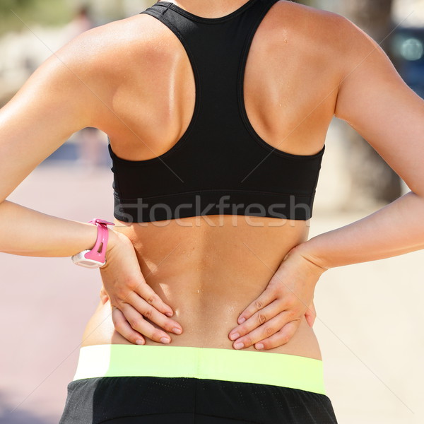 Sportverletzungen senken Rückenschmerzen Frau halten Körper Stock foto © Maridav