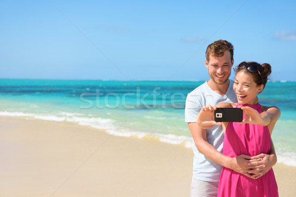 Couple Taking Selfie On Mobile Phone At Beach Stock photo © Maridav