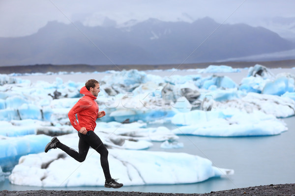 Running man sprinting trail runner in fast sprint Stock photo © Maridav