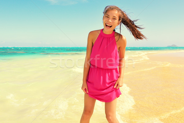 Happy Young Woman In Pink Dress Standing At Beach Stock photo © Maridav