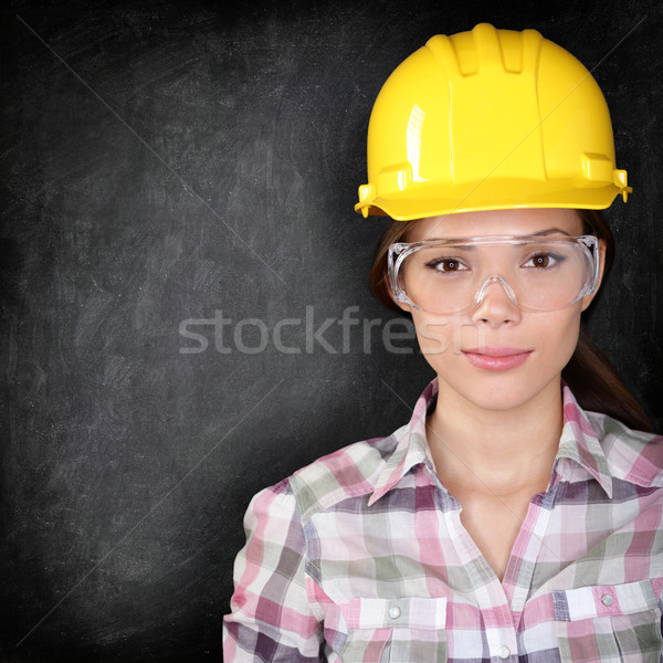 Construction worker woman on blackboard texture Stock photo © Maridav