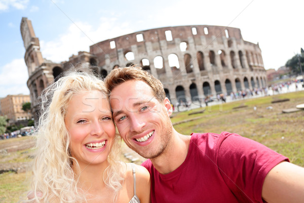 Tourist couple in Rome by Coliseum on travel Stock photo © Maridav