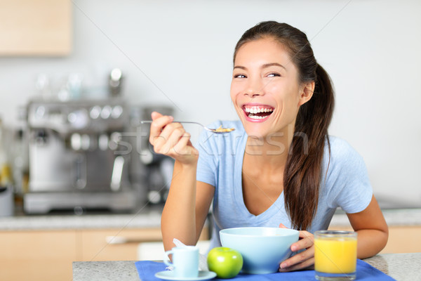 Woman eating breakfast cereals Stock photo © Maridav