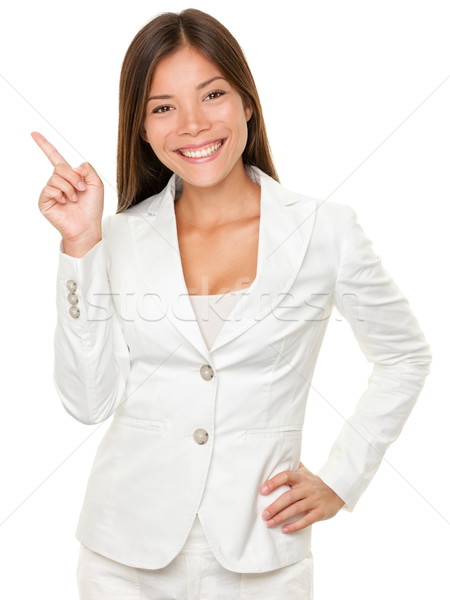 Businesswoman With Hand On Hip Pointing Sideways Stock photo © Maridav