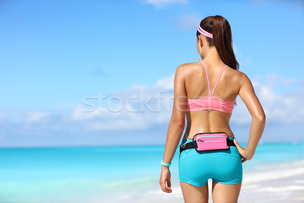 Runner woman with phone holder fitness smart watch Stock photo © Maridav