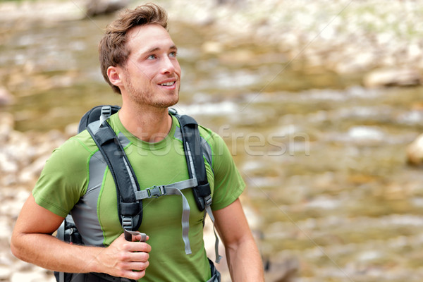 Happy hiker hiking in nature in clean river water Stock photo © Maridav