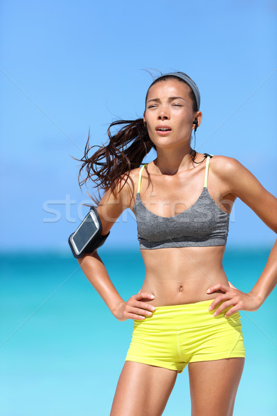 Tired runner athlete breathing hard after difficult cardio workout outdoor Stock photo © Maridav