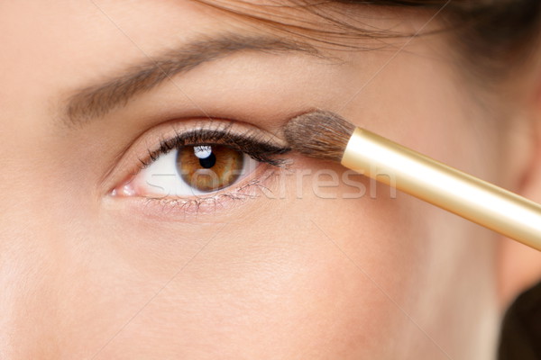 Eye makeup woman applying eyeshadow powder Stock photo © Maridav