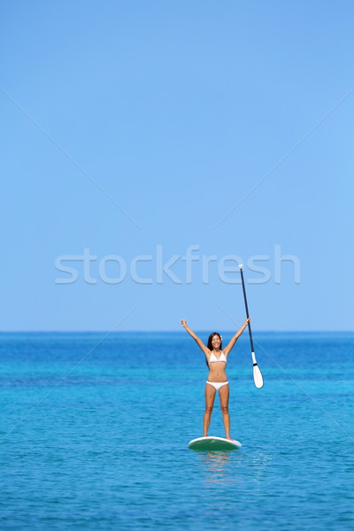Aspirational beach lifestyle woman on paddleboard Stock photo © Maridav