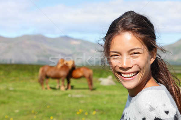 Woman on Iceland smiling with Icelandic horses Stock photo © Maridav