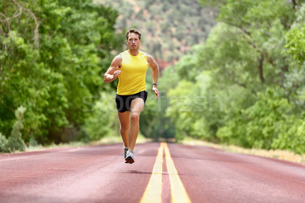 Running man runner sprinting for fitness health Stock photo © Maridav