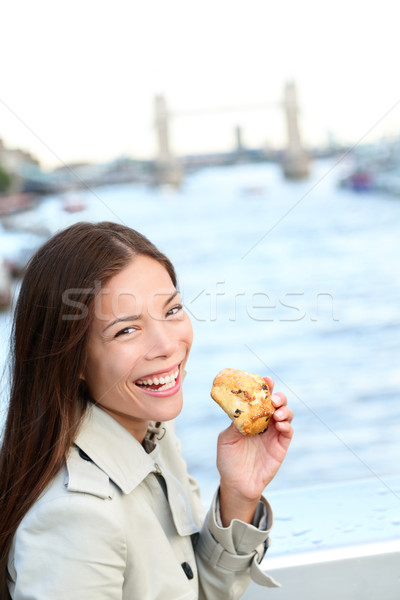 Scones - woman eating scone in London Stock photo © Maridav