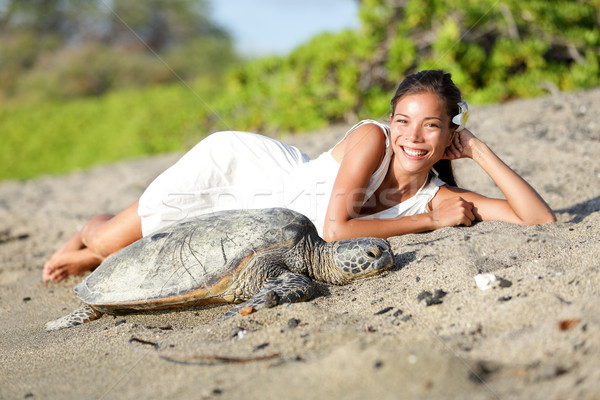 Turtle and woman lying on beach, Big Island Hawaii Stock photo © Maridav