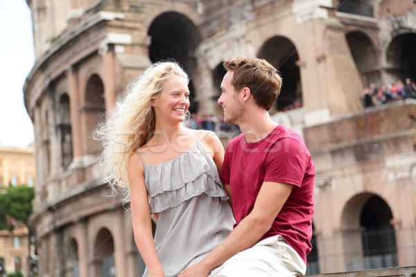 Travel couple in Rome by Coliseum in love Stock photo © Maridav