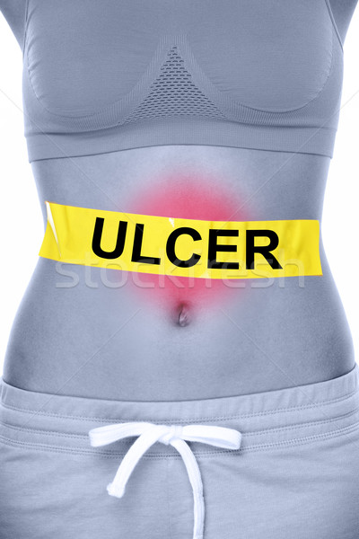 Stomach ulcer health problem showing woman abdomen Stock photo © Maridav