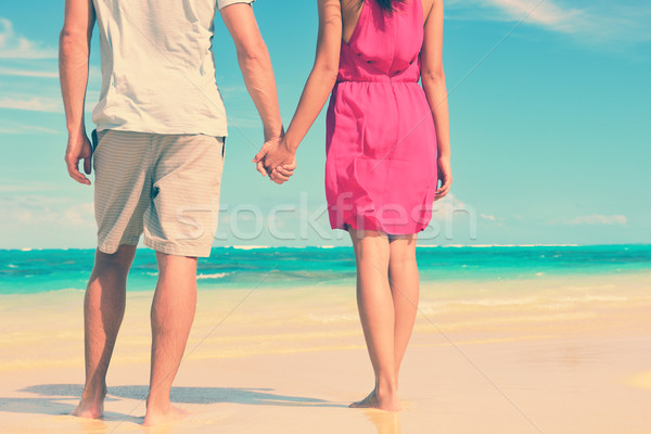 Low Section Of Couple Holding Hands On Beach Stock photo © Maridav