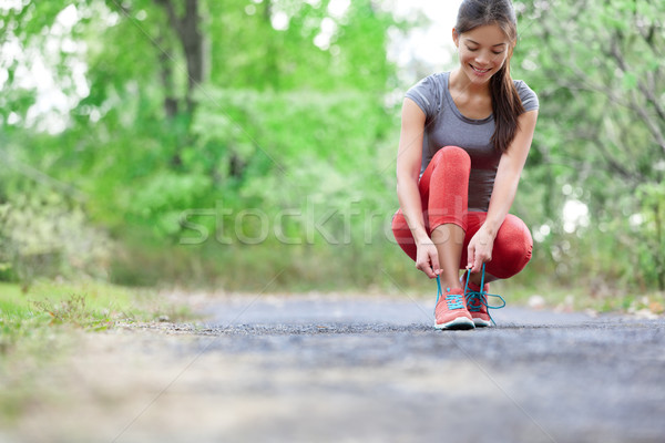 Running shoes - closeup of woman tying shoe laces Stock photo © Maridav
