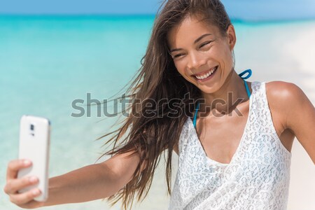 Happy girl on beach - candid young woman joyful Stock photo © Maridav