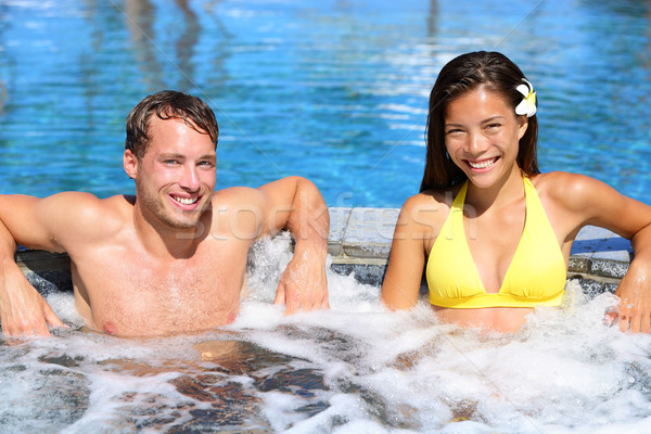 Hot tub - Couple in spa wellness jacuzzi Stock photo © Maridav