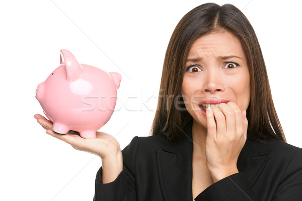 Money stress - business woman holding piggy bank Stock photo © Maridav