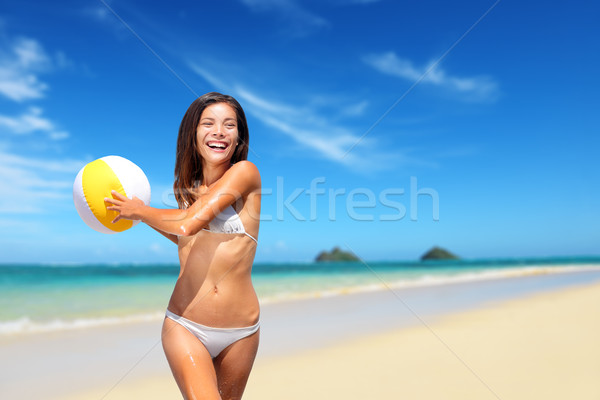 Beach woman playing with ball having fun on Hawaii Stock photo © Maridav