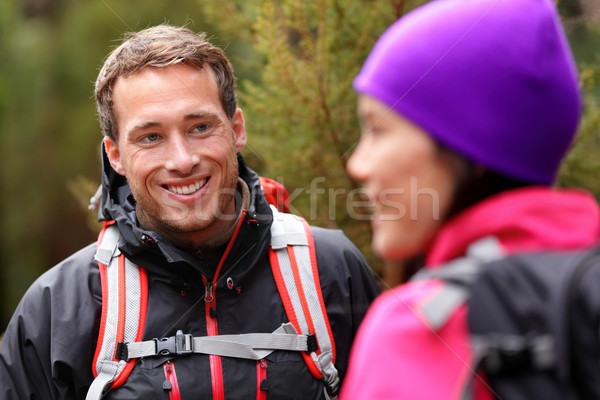 Stock photo: Male hiker portrait in forest talking with woman