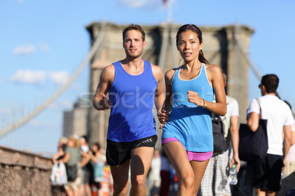 City running couple on Brooklyn bridge Stock photo © Maridav
