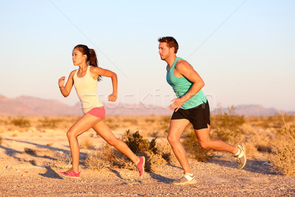 Cross-country trail running people at sunset Stock photo © Maridav