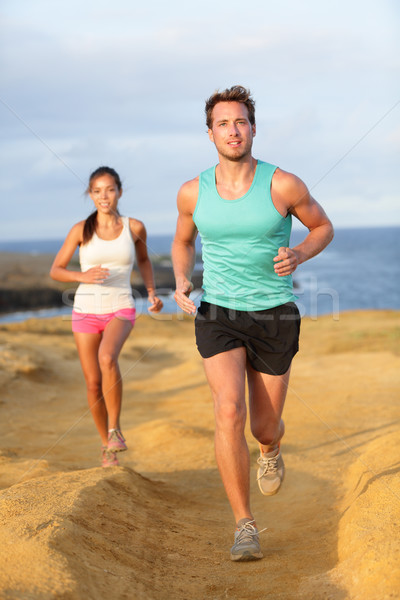 Runners couple jogging for fitness running outside Stock photo © Maridav