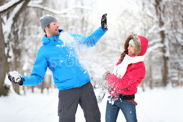 Young couple in snowball fight Stock photo © Maridav