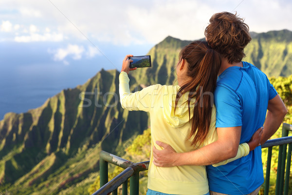 Couple taking pictures on Hawaii vacation in Kauai Stock photo © Maridav