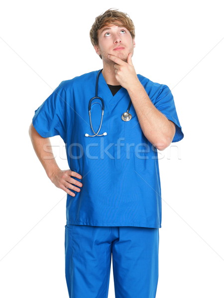 Male nurse / doctor thinking - man in scrubs Stock photo © Maridav