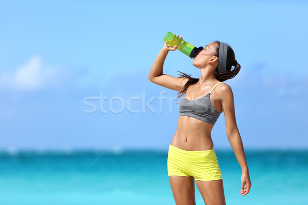 Fitness runner woman drinking water sport bottle Stock photo © Maridav