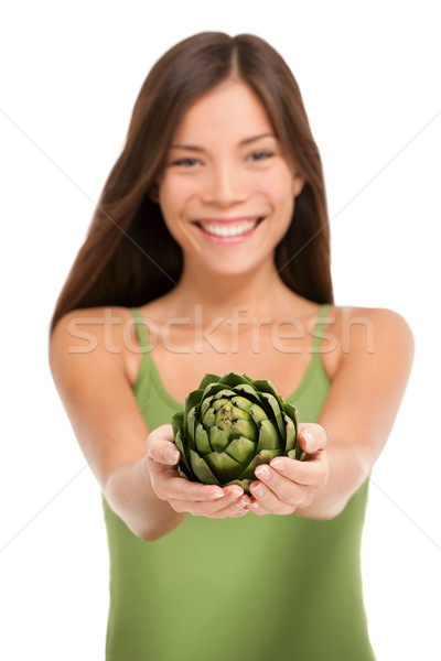 Woman holding fresh artichoke vegetable in hands Stock photo © Maridav