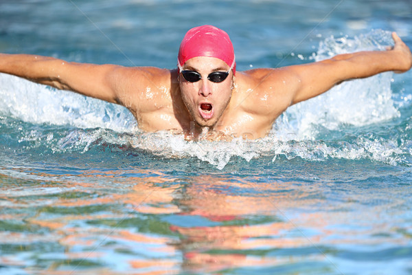 Swimmer athletic man swimming butterfly Stock photo © Maridav