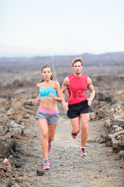 Runners couple running on trail in cross country Stock photo © Maridav