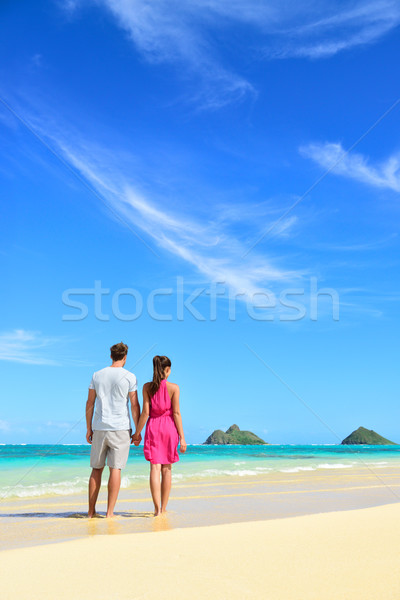 Beach vacation couple relaxing on summer holidays Stock photo © Maridav