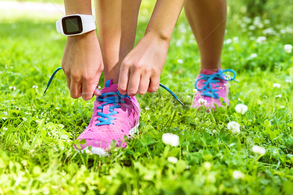 Active lifestyle smartwatch runner tying shoes  Stock photo © Maridav