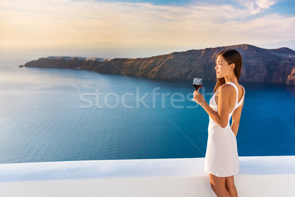 Luxury hotel woman drinking red wine in Santorini Stock photo © Maridav