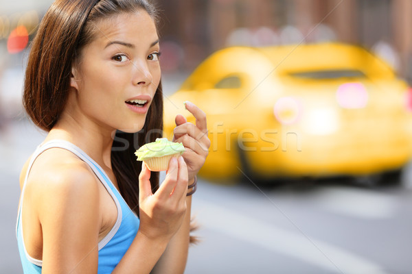 Stock photo: Cupcakes - woman caught eating cupcake snack