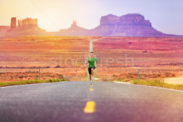 Runner man athlete running on road Monument Valley Stock photo © Maridav